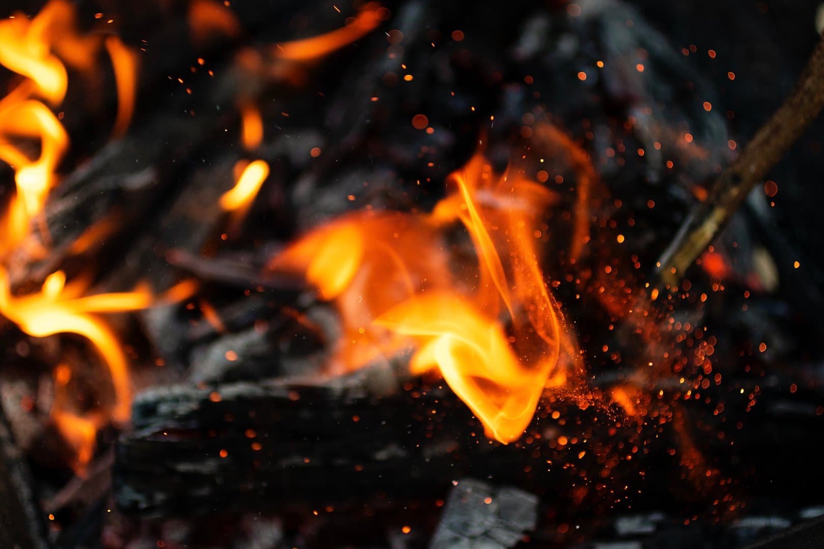 A campfire glowing in the dark